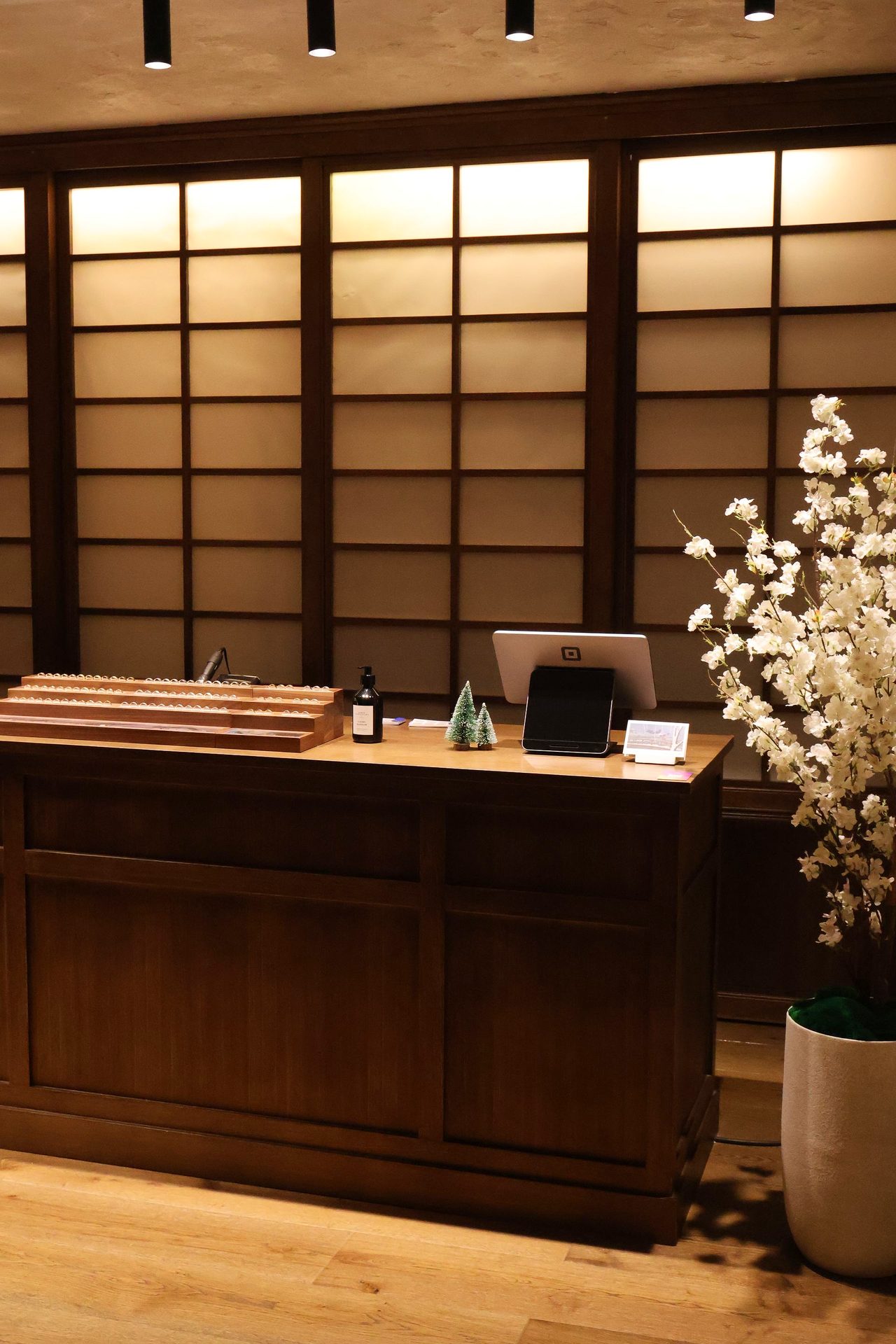 Counter detail with ambient lighting glowing through Japanese shoji panels