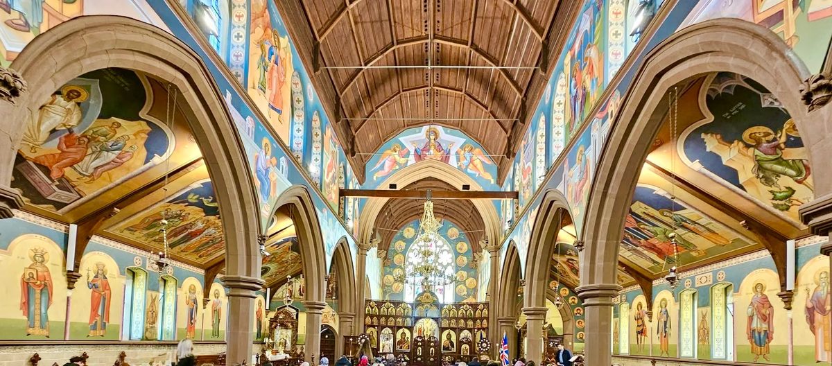 Romanian Orthodox church interior with specialist lighting illuminating hand-painted murals